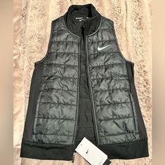 Brand New With Tags Womens Black Running Vest Size Xs. Functional Black Vest For Fall, Functional Black Outerwear For Spring, Functional Black Spring Outerwear, Black Sports Vest For Winter, Black Winter Sports Vest, Sporty Black Vest For Spring, Nike Black Outerwear For Work, Black Nike Outerwear For Work, Athleisure Black Winter Vest