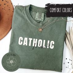 If you are in need for the perfect Catholic Shirt for Mom T Shirt Gifts for Catholic Mama Gift for Christian Mothers Day Gifts for Catholic Moms Short Sleeve Catholic Mama T, you have come to the right place! **Check out more fun designs and items in my shop! https://evandrugiftanddesign.etsy.com Comfort Colors introduces the "Comfort Colors 1717" garment-dyed t-shirt; a fully customizable tee made 100% with ring-spun cotton. The soft-washed, garment-dyed fabric brings extra coziness to your wardrobe while the relaxed fit makes it an excellent daily choice. The double-needle stitching throughout the tee makes it highly durable while the lack of side-seams helps the shirt retain its tubular shape. Discover all 58 colors in our Comfort Colors 1717 color charts below. .: The Comfort Colors 17 Cute Green Tops With Name Print, Customizable Green Cotton Tops, Green Letter Print Top As A Gift, Customizable Green Casual Tops, Customizable Casual Green Tops, Green Letter Print Top As Gift, Bible Mom Shirt, Christian Mama Shirts, Green Cotton T-shirt With Name Print