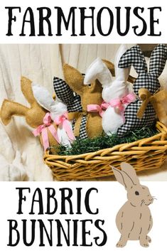 a basket filled with fabric bunnies sitting on top of a white bed next to a bunny