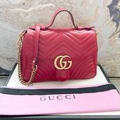 Beautiful Authentic Gucci Marmont Matelasse Small Top Handle Red Leather Bag. This Shoulder Bag Is Crafted Of Smooth And Supple Calfskin Leather. This Bag Features A Red Leather Handle, A Long Aged Gold Chain Shoulder Strap With Leather Shoulder Pad. The Front Crossover Flap Features An Interlocking Gg Logo That Opens To A Beige Fabric Interior With A Zippered Pocket. Very Good Condition. Includes Dust Bag Only. Measures Approx 10.5”X7.25”X4”. Retails $2690. Gucci Red Marmont Bag, Gucci Sling Bag, Gucci Marmont Matelasse, Gucci Disco, Red Leather Bag, Vintage Crossbody Bag, Gucci Crossbody, Gucci Marmont, Gg Logo