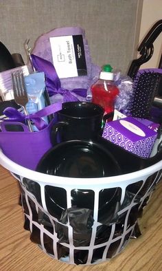 a basket filled with lots of items on top of a wooden floor