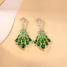 Product Title: Elegant Teardrop Chandelier Earrings, Dangle Earrings, Statement Earrings for Women, Crystal and Gemstone Drop Earrings Product Description: Presenting our exquisite collection of elegant teardrop chandelier earrings, perfect for adding a touch of glamour to any outfit. These dangle earrings are designed to make a statement, featuring a stunning combination of crystals and gemstones. Whether you're dressing up for a special occasion or adding sparkle to your everyday look, these e Green Teardrop Chandelier Earrings For Party, Green Chandelier Earrings With Pierced Ears, Green Dangle Teardrop Earrings For Party, Green Teardrop Bridal Earrings, Green Dangle Chandelier Earrings For Formal Events, Green Dangle Chandelier Earrings For Formal Occasions, Green Drop Crystal Earrings For Party, May Birthstone Crystal Dangle Earrings For Party, Green Emerald Dangle Chandelier Earrings