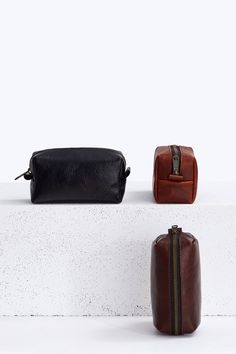 A small versatile cosmetic pouch made of high quality full grain Horween leather. It will come in handy both everyday and in travel. Ergonomic shape makes it easy to fit in a suitcase, bag, car or on a shelf at home. Made from a solid sheet of leather, without lining - so you can even smell the fine scent of genuine leather. The inside has a neat, clean look because the seams are wrapped in a cloth strip. Made with YKK Brass zipper - one of the best and most famous fastener manufacturers in the Everyday Leather Zipper Pouch Case, Leather Zipper Pouch Case For Everyday Use, Black Leather Travel Cosmetic Bag, Black Leather Pouch Cosmetic Bag, Black Leather Cosmetic Bag, Black Leather Cosmetic Bag For Daily Use, Minimalist Leather Pouch, Black Leather Rectangular Cosmetic Bag, Black Leather Cosmetic Bag With Zipper