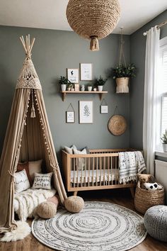 a baby's room with a teepee tent, rugs and other items