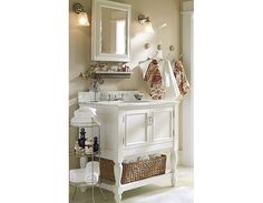 a bathroom with a sink, mirror and towel rack on the wall next to it