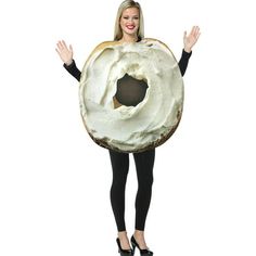 a woman wearing a giant donut costume