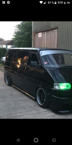 a black van parked in front of a building