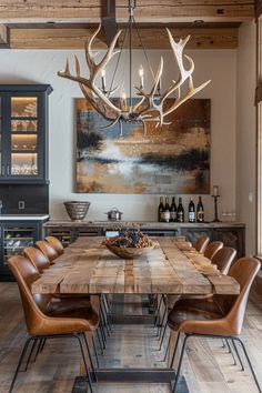 a large wooden table surrounded by brown leather chairs in a room with wood ceilinging