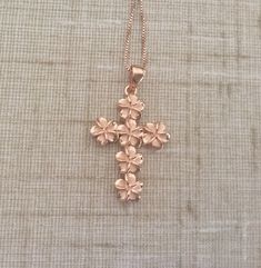 Solid .925 Large Sterling Silver with Rose Gold overlay Hawaiian 3-D Cross Plumeria Necklace. The size is 32x22MM plus the 7MM bail. Just stunning in person, it is designed to mimic the look of fine jewelry at a fraction of the cost. FREE Italian Sterling Silver Rose box chain included. The cross features six 8MM Plumerias with Sandblasted Matte centers and High-Polished shiny edges. --The Plumeria is iconic of Hawaiian culture. It's bright colors and magnificent scent greet both visitors and lo Sterling Silver Rose Design Jewelry For Gift, Rose Gold Engraved Flower Shaped Necklace, Rose Gold Engraved Flower Necklace, Rose Gold Flower-shaped Engraved Necklace, Engraved Rose Gold Flower-shaped Necklace, Rose Gold Jewelry With Hallmark For Gift, Rose Gold Jewelry Gift With Hallmark, Rose Gold Jewelry With Rose Design For Anniversary Gift, Rose Gold Jewelry With Rose Design For Anniversary