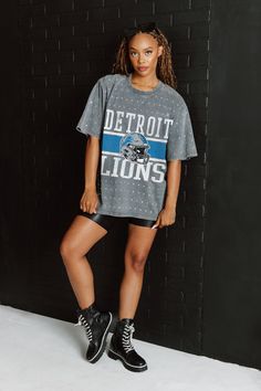 Make a statement in any crowd with our Detroit Lions oversized fit, all-over mini rhinestone short sleeve tee featuring a ribbed neckline. Embrace the sparkle while staying comfortable—perfect for every dedicated fan. Detroit Lions Game Day Outfit, Game Day Relaxed Fit Short Sleeve Tops, Relaxed Fit Short Sleeve Tops For Game Day, Oversized Short Sleeve Top With All Over Print, Oversized Short Sleeve Top With All-over Print, Athleisure Short Sleeve Tops For Game Day, Athleisure Sublimation Print Short Sleeve Tops, Gray Short Sleeve Fan Apparel Top, Sporty Short Sleeve Tops With All Over Print