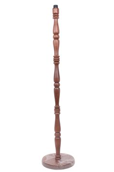 a tall wooden candle holder on a white background