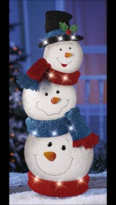 three snowmen are stacked on top of each other