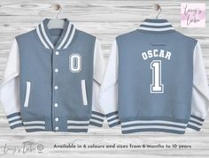 Looking for the perfect personalised custom kids varsity jacket? This supersoft, college baseball children's varsity jacket is the ultimate blend of style and comfort. With its letterman style design, it's a must-have for kids, toddlers and babies alike.  Featuring a name on the back and initial on the front, our jacket allows you to add a personal touch that your child will love. It's the ideal birthday, new baby, christening, or Christmas gift. Plus, with the option to match siblings, you can White Varsity Jacket With Ribbed Cuffs For Game Day, White Varsity Jacket With Letter Patch And Baseball Collar, White Varsity Jacket With Team Name, White Varsity Jacket With Team Name For College, White Varsity Jacket For College With Team Name, College White Varsity Jacket With Team Name, White College Varsity Jacket With Team Name, White Varsity Jacket With Team Spirit Letter Print, Blue Outerwear With Baseball Collar For School