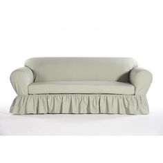 a couch with a ruffled cover on it