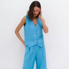 Discover Your Sophisticated Side Embrace elegance and comfort with our Chic Cotton-Linen Blend Sleeveless Vest and Wide-Leg Pants Set. Tailored for the contemporary woman who values style as much as comfort, this ensemble is your ticket to sophisticated simplicity. Ideal for various occasions, from a laid-back brunch to a professional setting, this two-piece set is your go-to for making an impression while staying utterly at ease. Elevate Your Wardrobe with Exquisite Details Experience the difference with our specially crafted set. The regular fit flatters a range of body shapes, providing a graceful silhouette. Crafted from a premium mix of cotton and linen, the woven fabric ensures breathability and longevity, suitable for all seasons. Its solid pattern exudes a timeless charm, and the t Sleeveless Denim Blue Vest With Button Closure, Casual Blue Sleeveless Set, Denim Blue Sleeveless Vest With Button Closure, Sleeveless Blue Linen Top, Washed Blue Sleeveless Cotton Vest, Street Mode, High Street Fashion, Sleeveless Vest, Pantalon Large