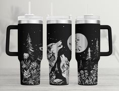 two black and white travel mugs with the same design on them, one is full of