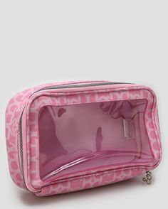 a pink toilet bag sitting on top of a white floor