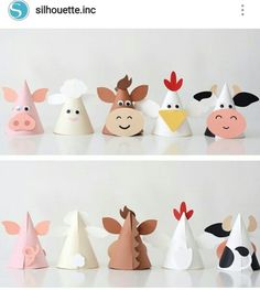 several paper hats with farm animals on them