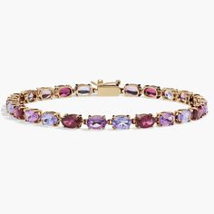 Bright tanzanite, amethyst and rhodalite stones shimmer brilliantly in this bracelet, summoning the eye to their rainbow of hues. The warmly lustrous 14k yellow gold design promises exquisite luxury that lasts. Precious Gemstones Jewelry, Gemstone Bracelets, Tennis Bracelet, Gold Design, The Eye, Semi Precious Gemstones, Gemstone Jewelry, Jewelry Bracelets, Tennis