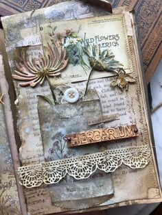 an altered book with flowers and words on it