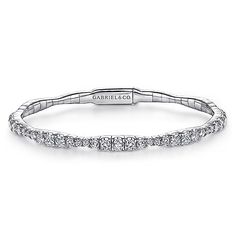 Add a little majestic flair to your bracelet stacking with this sparkling bangle style from our Demure collection. Comprised of a delicate 14K white gold base, its entire foundation is adorned with 1.87 ct diamonds that encompass the circumference in a graduating design feature. With just the right amount of sparkle to spare, this bangle is modest enough to pair with multiple bracelets while also stunning as a solo accessory. Stackable White Gold Cubic Zirconia Diamond Bracelet, Stackable Cubic Zirconia Diamond Bracelet In White Gold, Elegant Stackable Sterling Silver Bracelet For Anniversary, Elegant Sterling Silver Stackable Bracelet For Anniversary, Elegant Diamond White Stackable Bracelets, Diamond White Stackable Diamond Bracelets, Elegant White Gold Stackable Bracelets, Elegant Stackable Sterling Silver Bangle Bracelet, Elegant Stackable Diamond Tennis Bracelet