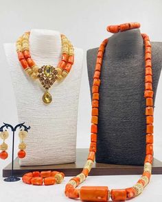 Handcrafted African Coral Beads Necklace - Unique Ethnic Jewelry for a Statement Look NEED OTHER DESIGNS OF BRIDE AND GROOM CORAL BEADS, AFRICAN PRE-TIED HEADWRAPS, BRAIDED WIGS AND AFRICAN GIFT ITEMS, VISIT OUR SHOP HERE: https://sereneafrica.etsy.com/ Materials: 1. Natural/Original African Coral bead 2. Gold color accessories  3. This listing contains 3 layers of necklace, 2 bracelets, a set of dangling earrings for bride/woman and 2 pieces of necklace and 1 bracelet for men. PLEASE NOTE THE V Wedding Beaded Necklaces With Polished Oval Beads, Traditional Gold Beaded Necklaces For Ceremonies, Traditional Bridal Necklace With Large Beads, Gold Bridal Necklace With Colorful Beads For Wedding, Traditional Bridal Necklace With Round Beads For Marriage, Gold Oval Beads For Wedding, Traditional Gold Bead Necklaces For Ceremonies, Orange Beaded Necklaces For Wedding, Gold Beaded Necklace For Marriage