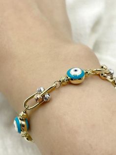 14k Solid Gold Evil Eye Bracelet for Women/Greek Evil Bracelet/Protection Charm Bracelet/U Link Chain/Dolphin Charm Bracelet/Christmas Gift This 14k Solid Gold evil eye bracelet is perfect for layering and will add a unique and chic vibe to your stack. Our good luck bracelet would make a perfect gift for her. PRODUCT DETAILS Made to order Gold: 14K Solid Gold Avg. Weight: 8.50- 9.50 grams Bracelet Length: 5.00 inches- 8.00 inches Choice of Gold: Rose Gold, Yellow Gold, White Gold ❗ CUSTOMIZATION Evil Bracelet, Gold Coin Choker, Gold Evil Eye Bracelet, Amethyst Ring Vintage, Good Luck Bracelet, Solid Gold Bracelet, Bracelet Christmas, Lucky Stone, Christmas Bracelet