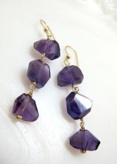 "Drop earrings Dangle earrings Amethyst jewelry Gemstone jewelry  Elegant drop earrings feature three tiers of faceted, deep purple amethyst gemstones that cascade 2.25\" from 14K gold filled ear wire. 14K gold filled wire wrapping. No two stones are exactly alike so they will have natural inclusions; shapes/sizes/faceting will vary from stone to stone. ** Want them in silver? Need more than one pair? Send me a message for a custom listing ** To keep your piedra jewelry looking its best, store i Cheap Gemstone Beads Drop Earrings, Cheap Gemstone Drop Earrings, Luxury Handmade Amethyst Earrings, Luxury Handmade Purple Earrings, Purple Drop Earrings, Jewelry Purple, Drop Earrings Gold, Jewelry Elegant, Purple Jewelry