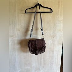 Pre Owned But Looks Brand New. Magnetic Closure. Lined Fringe Handbags Purses, Fringe Handbags, Purse Crossbody, Suede Fringe, Handbag Purse, Brown Suede, Magnetic Closure, Purses Crossbody, Crossbody Bags