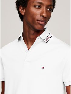 Tommy Hilfiger men's polo. Introducing our cotton interlock polo, known for its smooth handfeel and durability, cut in an easy fit and finished with our monotype logo stripe at the collar.  Material: 100% Cotton (rgc). Cotton Polo Shirt With Three Stripes Branding, Cotton Polo Shirt With Three Stripes And Collar, Cotton Collared Polo Shirt With Three Stripes Branding, Cotton Striped Collared Polo Shirt, Cotton Polo Shirt With Signature Stripes, Classic Collared Polo Shirt With Signature Stripes, Classic Polo Shirt With Signature Stripes, White Collared Polo Shirt With Signature Stripes, Classic Polo Shirt With Striped Collar For Golf