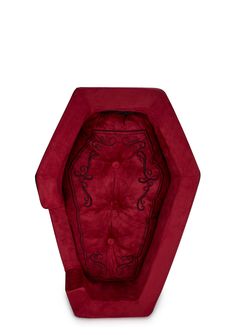 a red chair with an intricate design on the back