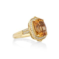 Indulge in the mesmerizing allure of this 5.04 Cts Citrine and White Diamond Ring. Crafted in 14K yellow gold, this exquisite piece showcases a stunning citrine gemstone surrounded by a halo of dazzling white diamonds. With its timeless design and elegant sparkle, this ring is a true statement of beauty. Luxury Citrine Diamond Ring With Halo Setting, Luxury Citrine Rings With Diamond Accents, Luxury White Gold Citrine Diamond Ring, Luxury Citrine Diamond Ring In Yellow Gold, Luxury Yellow Gold Citrine Diamond Ring, Citrine Diamond Ring With Accent Stones In Yellow Gold, Yellow Gold Citrine Diamond Ring With Accent Stones, Classic Yellow Gold Topaz Ring With Gemstone Accents, Formal Citrine Diamond Ring With Center Stone