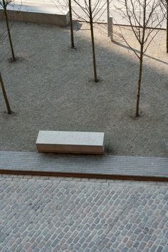 a bench sitting in the middle of a park