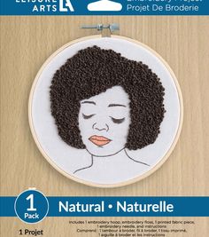 an embroidery kit with a woman's face on it