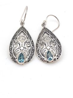 "Intricately detailed sterling silver Bali teardrop earrings with a pear-shaped semi-precious stone at the bottom measures 1 3/4\" in length from the top of the ear wire and 5/8\" in width at its widest point. The pear-shaped stone measures 1/8\" in width and 3/16\" in length. Earrings are rhodium plated over sterling silver so as to prevent tarnishing." Sterling Silver Teardrop Earrings With Intricate Design, Sterling Silver Intricate Teardrop Earrings, Sterling Silver Filigree Teardrop Earrings, Ornate Sterling Silver Teardrop Earrings, Ornate Teardrop Earrings As Gift, Pierced Teardrop Drop Earrings In Sterling Silver, Silver Gemstone Teardrop Earrings, Pierced Pear-shaped Teardrop Earrings, Sterling Silver Gemstone Teardrop Earrings