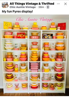 a white shelf filled with lots of yellow and pink dishes on top of it's sides