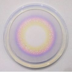 a white plate with a purple and yellow design on it