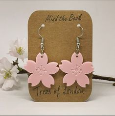 London spring is here with all the lovely cherry blossom trees. With this order you will get one of those cards for free. 🌸 Hooks: lead free, nickel free. Antique-silver-plating. Large pastel pink flower with some great detail.  Laser cut acrylic, 30 mm across. The surface on the back is smooth and shiny. Blossom Colored Flower Charm Earrings For Spring, Blossom Color Flower Charm Earrings For Spring, Blossom Flower Charm Earrings For Spring, Blossom Color Earrings With Flower Charm For Spring, Spring Pink Earrings With Flower Charm, Pink Flower Shaped Earrings For Spring, Trendy Hypoallergenic Flower Earrings For Spring, Pink Flower Charm Earrings For Spring, Spring Flower Hypoallergenic Earrings