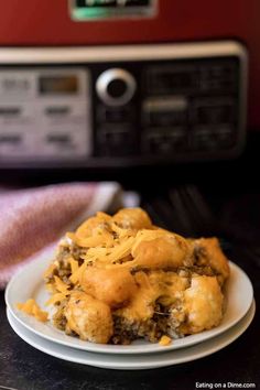 a white plate topped with food next to an oven