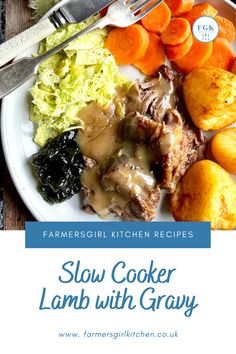 slow cooker lamb with gravy on a white plate next to carrots and potatoes