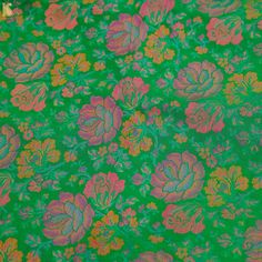 a green background with pink and orange flowers