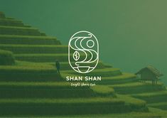 the logo for shan shan is shown in front of a green field with two people standing on