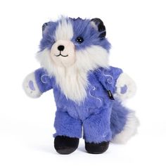 a blue and white stuffed animal is posed