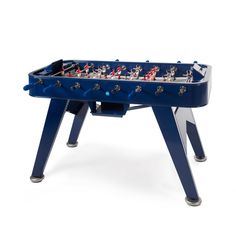 a blue foosball table sitting on top of a white floor