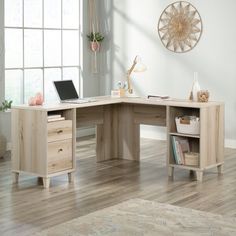 a wooden desk with two drawers and a laptop on it