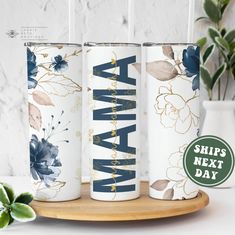 three personalized tumbles with the word mama printed on them, sitting on a wooden tray