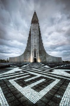 a very tall building with a massive tower in the middle of it's floor