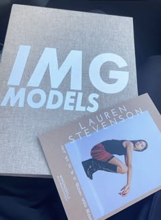 the book img models is sitting on top of a bag