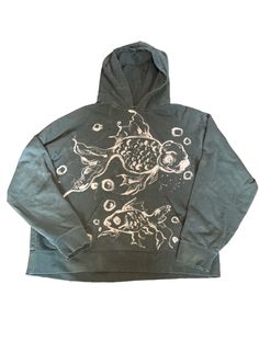 a hoodie with an image of a fish on it