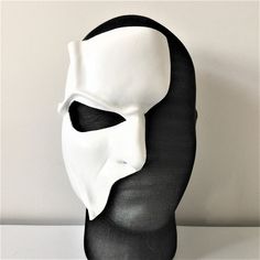 DESCRIPTIONHaunt the Paris Opera House Palais Garnier! You'll steal the stage in this extremely detailed white leather half-face mask is fabulous for theatre productions, masquerade balls, Mime costume or Halloween parties. Waterproofed, so fantastic for outdoor theater, Renaissance Festivals, or Burning Man. Any color. Waterproofed leather, glossy or matte finish, & several choices to affix the mask (cord, elastic, ribbon, waterproof cord, or no holes for adhesive). Measurements: 8" high x Venetian White Mask For Costume Party, White Masks And Prosthetics For Carnival Costume Party, White Fantasy Masks And Prosthetics For Costume Party, Halloween White Masks And Prosthetics For Costume Party, White Masks For Carnival Costume Party, Fantasy White Masks And Prosthetics For Costume Party, White Masquerade Mask For Halloween Costume, White Masks And Prosthetics For Carnival Masquerade, White Masks And Prosthetics For Masquerade And Cosplay